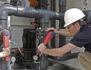 Service man controlling valves